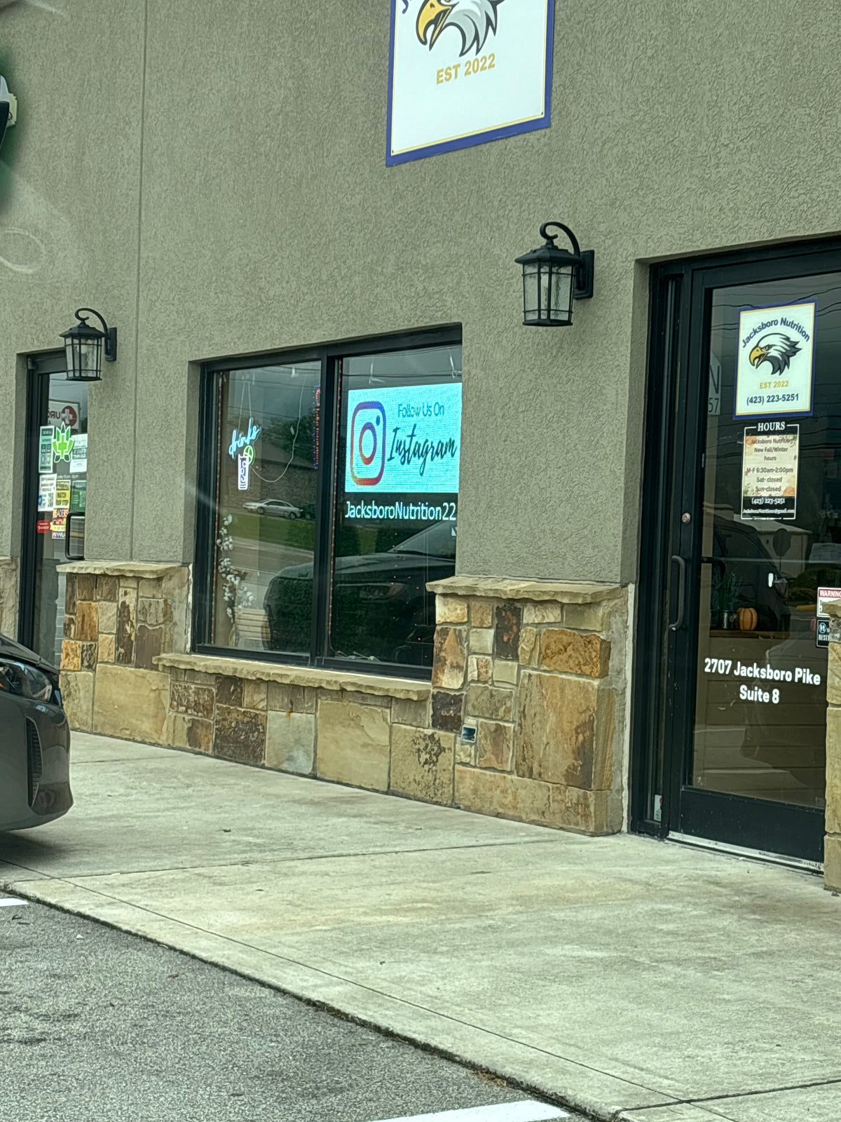 26x40 P5 LED window sign hanging in a storefront